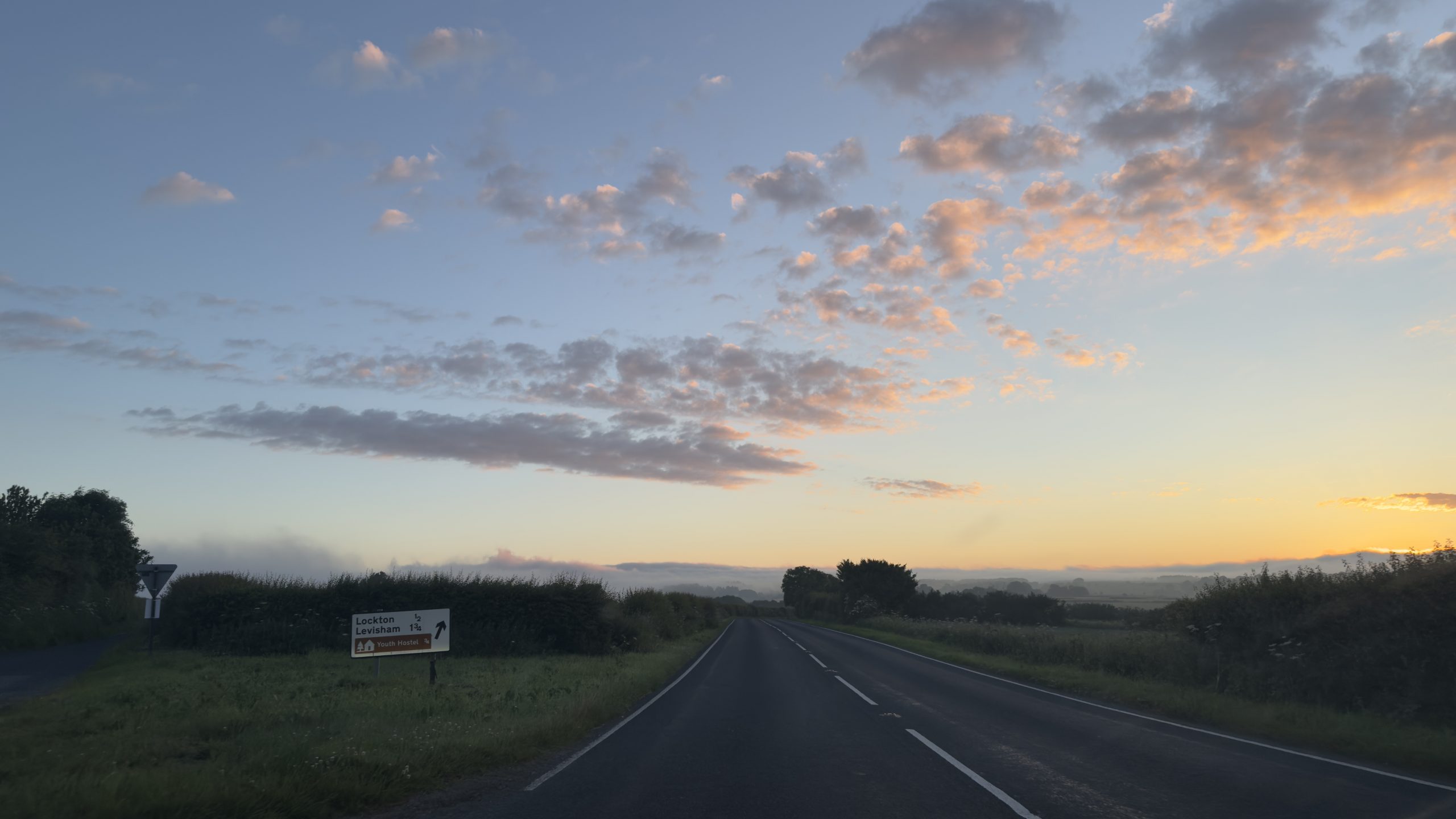 Misty sunrise on the road, setting off